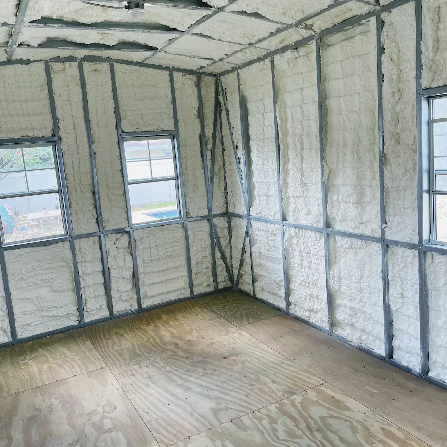 Closed-cell spray foam insulation applied to wall cavities in a residential project in Vidor